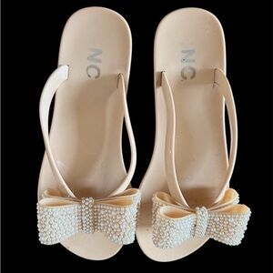 NYC Pearl-Embellished Nude Bow Slide Sandals